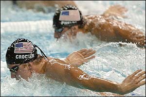 Michael Crocker and Michael Phelps race in the 100m butterfly final