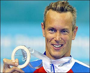 Mark Foster shows off his silver medal