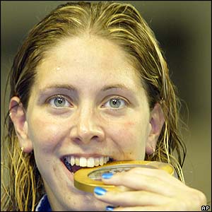 Katy Sexton gets to grips with her gold medal after her success in the 200m backstroke final