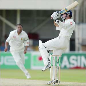 Michael Vaughan hooks the ball towards the boundary rope
