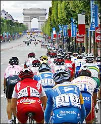 The riders head down the Champs Elysees in Paris