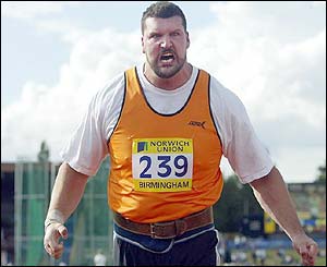 Carl Myerscough celebrates his winning throw in the shot put