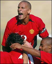 Rio Ferdinand celebrates with Ruud van Nistelrooy after the Dutchman opens the scoring