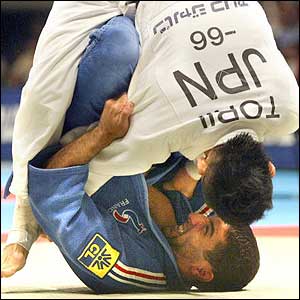 France's Lenrique Benboudaoud throws Japan's Tomoo Torii at the World Judo Championships in Osaka