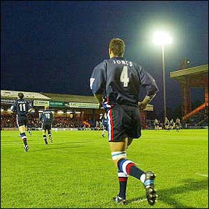 Lock Chris Jones and the Sale Sharks players come out onto the pitch at the start of the Zurich Premiership season