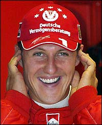 Michael Schumacher plugs his ears