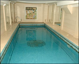 The painting at the far end of the indoor swimming pool is expected to sell for �1,500.