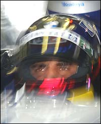Juan Pablo Montoya sits in his Williams before going out on the track in qualifying