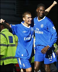 Adrian Mutu celebrates scoring his second goal with Marcel Desailly