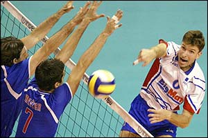 France's Laurent Capet (right) returns the ball to Dula Mester and Goran Vuje of Serbia & Montenegro 