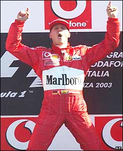 Michael Schumacher celebrates victory on the podium