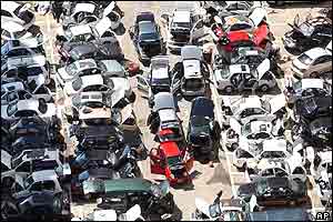 Dozens of cars, which were damaged by Typhoon Maemi, are parked to dry in the sun 