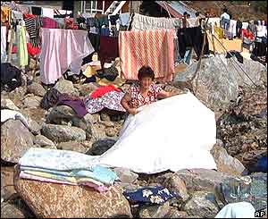 South Korean woman dry clothes and belongings in the sun