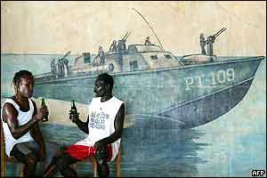 Tingo Leve (L) and Solo Lamusalanga (R) enjoy a beer at the PT-109 Bar on Ghizo Island 