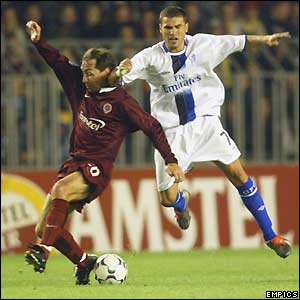Jiri Nemec of Sparta Prague tries to regain his balance under pressure from Chelsea's Adrian Mutu 