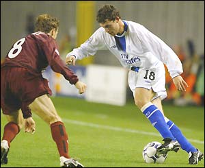 Karel Poborksy prepares to tackle Wayne Bridge