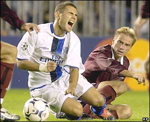 Adrian Mutu goes down under a challenge from Rastislav Michalik 