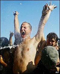 Fan being squirted with water