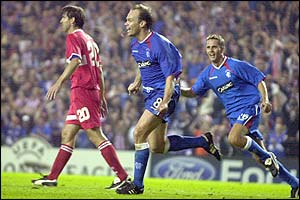 Christian Nerlinger celebrates as he scores Rangers' equaliser in the 74th minute