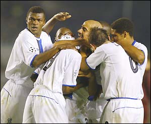 Chelsea mob William Gallas (hidden) after he scores the winner