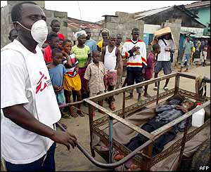 MSF nurse pushes an old man sick with cholera