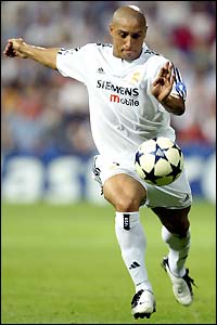 Roberto Carlos volleys towards goal