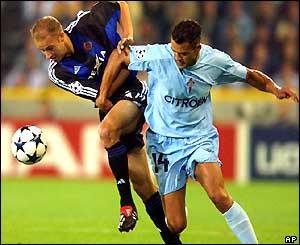 Club Bruges' Olivier de Cock tries to hold off Celta Vigo's Juanfran