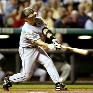 Houston Astros' Craig Biggio is hit on the foot by Chin-hui Tsao of the Colorado Rockies
