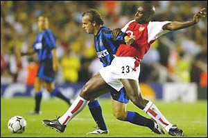Inter's Andy Van der Meyde tussles with Sol Campbell of Arsenal