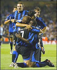 Inter Milan mob Andy Van der Meyde after he scores their second goal