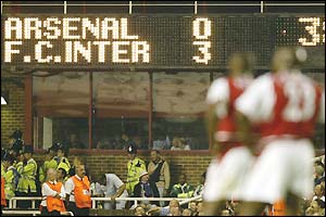 The scoreboard at Higbury displays 'Arsenal 0-3 Inter Milan'
