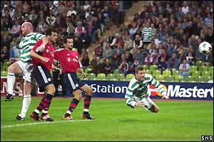 Alan Thompson (right) heads the ball in off the near post