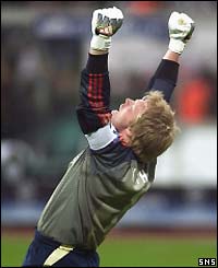 Bayern keeper Oliver Kahn punches the air in delight to celebrate victory