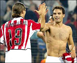 Fernando Morientes (right) celebrates victory with team-mates after the final whistle