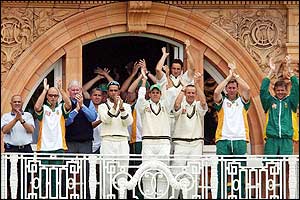 The South African players applaud Smith's second century of the series