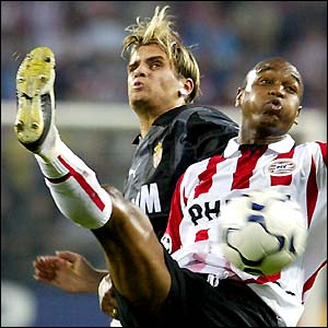 PSV Eindhoven's Jurgen Colin gets in front of Monaco midfielder Jerome Rothen during the Dutch side's 2-1 Champions Legaue defeat