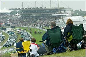 Racegoers on Trundle Hill watch the Oak Tree Stakes 