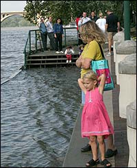 Residents overlooking the flooded Potomac