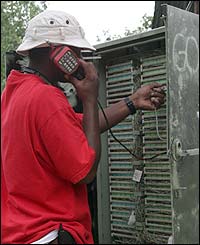 Technician fixes phones in Tenleytown
