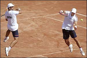 Argentina's Lucas Arnold returns the ball as Agustin Calleri covers during their Davis Cup semi-final doubles match against Spain
