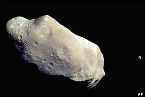 243 Ida asteroid (with Ida's moon Dactyl visible on the right)