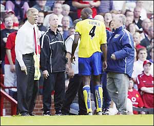 Vieira is escorted off the pitch