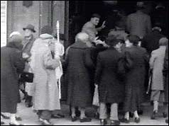 Group of pensioners walking into Central Hall