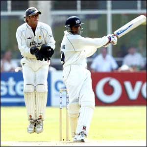 Gloucester's Shoaib Malik smashes a boundary on his way to a commanding 74 