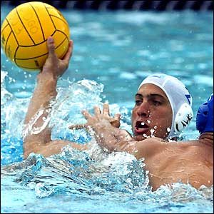 Argentina's Diego Gusto struggles for the ball with Puerto Rican Jose Ortiz during a water polo match at the Pan American Games
