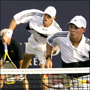 Bob Bryan and Mike Bryan play doubles in a match against Tommy Robredo of Spain and Rainer Schuettler during the Tennis Masters Canada series