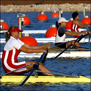 Athletes compete in the women's single sculls race during the World Rowing Junior Championship at the Olympic rowing centre at Schinias, Greece