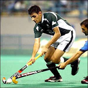 Viren Rasquinha of India (right) tries to steal the ball