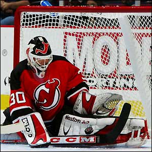 New Jersey Devils goalie Martin Brodeur makes a dramatic save 