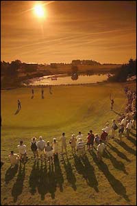 Crowds at the Nordic Open in Copenhagen watch Englishman David Gilford putt at the tenth hole